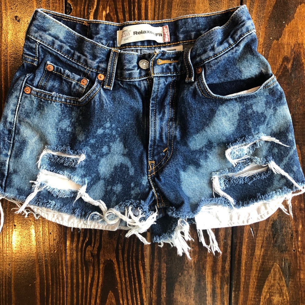 Cutoff Levi’s. Distressed and bleached. Size 14